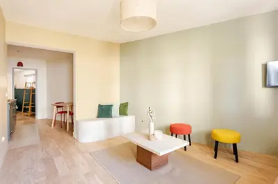 a living room with a table and two chairs at Cocoon et style - proche du centre in Aix-en-Provence