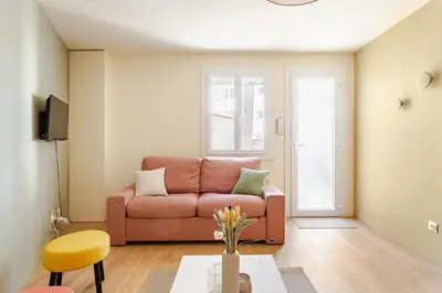 a living room with a couch and a table at Cocoon et style - proche du centre in Aix-en-Provence