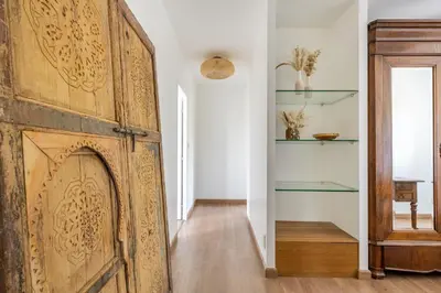 an old wooden door in a room with a hallway at Villa Sun7 in Crillon-le-Brave