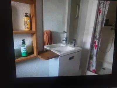 a bathroom with a sink and a mirror at Superbe appartement au pied du Mont Ventoux in Caromb