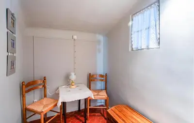 a room with a table and two chairs and a window at 3 Bedroom Stunning Home In Saignon in Saignon