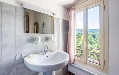 a white sink in a bathroom with a window at 3 Bedroom Stunning Home In Saignon in Saignon