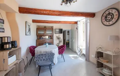 a kitchen and dining room with a table and chairs at 3 Bedroom Stunning Home In Saignon in Saignon