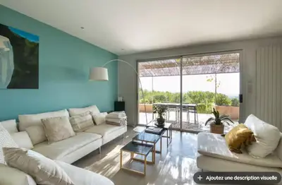 a bathroom with a toilet and a sink and a skylight at Maison et studio avec vue panoramique et piscine in La Bastidonne