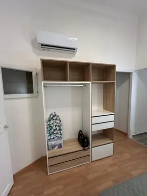 a room with a closet with a fan in it at T2 centre-ville avec parking privé inclus in Cavaillon