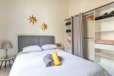 a bedroom with a bed with towels on it at Beautiful 3 bedrooms in a detached house in Aix-en-Provence