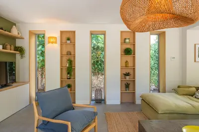 a living room with a couch and a chair at L'Echappée aixoise in Aix-en-Provence