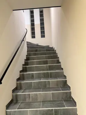 a staircase in a building with concrete steps at Bonpas Appart Hotels in Avignon