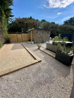 a backyard with a garden with two potted plants at Maison avec jaccuzzi Aix-en-Provence in Aix-en-Provence