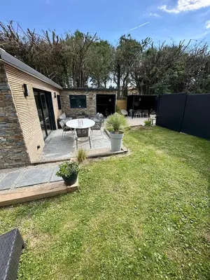 a backyard with a patio with a table and chairs at Maison avec jaccuzzi Aix-en-Provence in Aix-en-Provence