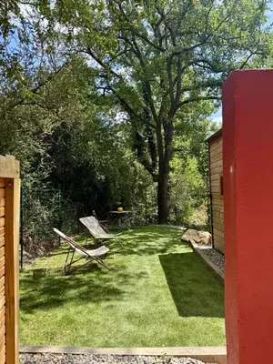 a picnic table and a bench in a yard at Domaine Saint Roch in Saint-Paul-lez-Durance