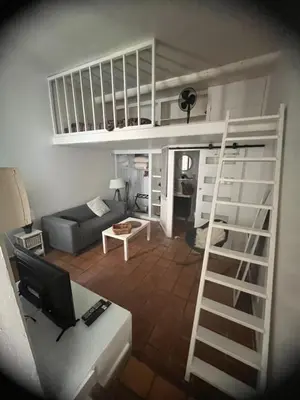 a living room with a loft bed and a couch at Cosy studio aix en Provence à 1 minutes du cours Mirabeau in Aix-en-Provence