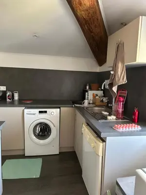 a kitchen with a washer and a washing machine at Bel Appartement au 2 eme in Aix-en-Provence
