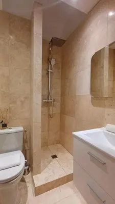 a bathroom with a toilet and a sink and a shower at Le Calisson, magnifique studio plein centre d'Aix in Aix-en-Provence