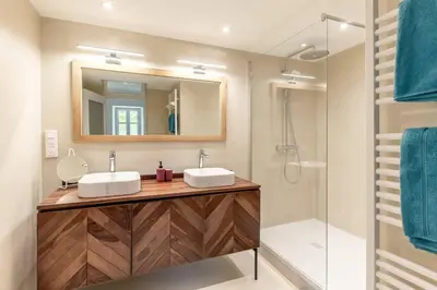 a bathroom with two sinks and a shower at LOasis de Gordes Provence Pool Villa Retreat in Gordes