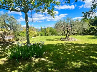 a bush with white flowers in front of a window at Le Mas Jorel Luxury Pool Villa with Mountain View in Gargas