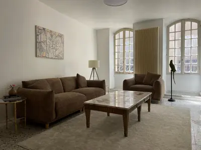a living room with two couches and a coffee table at Escapade en Provence Centre de Gordes in Gordes