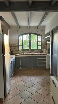 a large kitchen with a sink and a window at Art Appartement Kristina 80m2 in Graminier