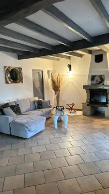 a living room with a couch and a table at Art Appartement Kristina 80m2 in Graminier