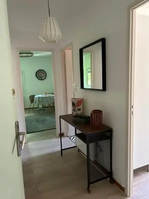 a room with a desk and a mirror and a table at Cocon douillet près du Cours Sextius in Aix-en-Provence