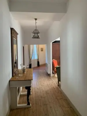 a bathroom with a toilet and a sink and a mirror at Château Sainte BARBE in Loriol-du-Comtat