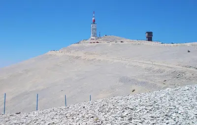 a hill with a lighthouse on top of it at Maison Avec Piscine in Villars