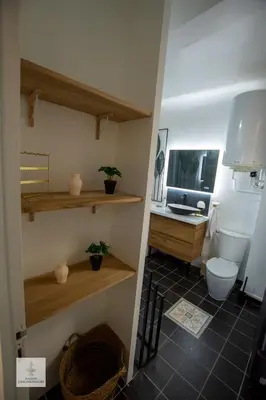 a bathroom with a toilet and a desk at Maison des Chaudronniers in Aix-en-Provence
