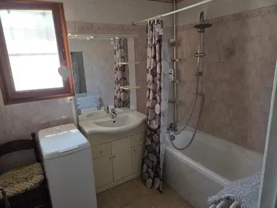 a bathroom with a sink and a tub and a shower at Villa avec piscine privée in Alleins