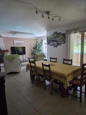 a dining room with a table and chairs at Villa avec piscine privée in Alleins