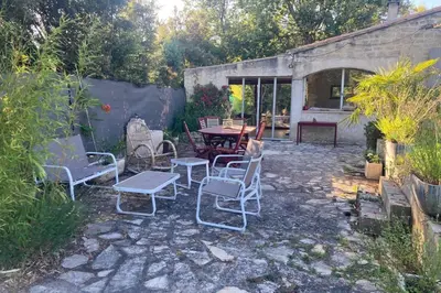 a group of chairs and a table in a yard at Villa Caromb - Mont Ventoux Garden - by TGB in Caromb
