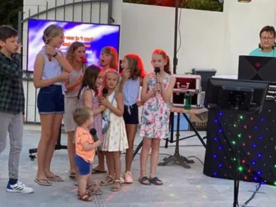 a group of children standing in front of a microphone at Chalet 46m² avec Terrasse à Noves - API-1-52-531 in Noves