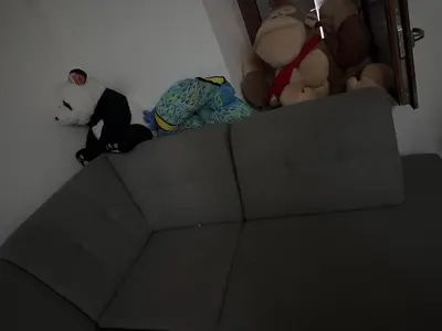 a pile of stuffed animals sitting on top of a bed at Apparemment t3 in Noves