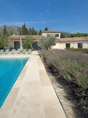 a villa with a swimming pool and a house at Villa des Glauges in Eyguières