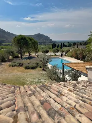 a view of a swimming pool from the roof of a house at Villa des Glauges in Eyguières
