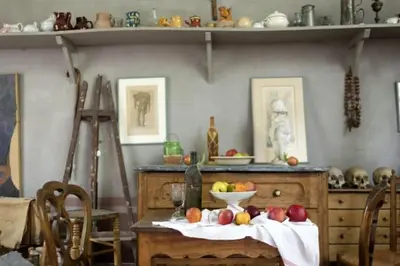 a kitchen with a table with a bowl of fruit on it at Evasion Aixoise logement T2 au Centre historique in Aix-en-Provence