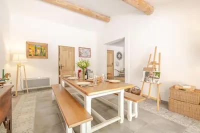 a dining room with a table and a bench at La Mathilde - Premium Pool Villa Private Tree-Top Adventure in Bonnieux