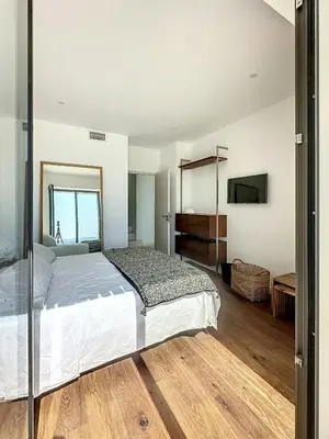 a living room with a couch and a large glass window at Villa With Panoramic Views And Pool In Gordes in Gordes