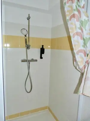 a shower with a shower head in a bathroom at Le Clos d'AIX Studio 113 in Aix-en-Provence