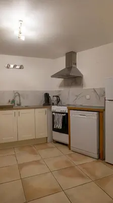 a kitchen with a sink and a stove top oven at Duplex en centre ville avec un Garage privé in Salon-de-Provence