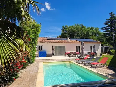 a swimming pool in front of a house at Villa Eguilles, ensoleillée, piscine à 10 mn d' Aix en Provence in Éguilles