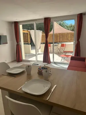 a table with plates and cups on top of it at Suite jacuzzi in Aix-en-Provence