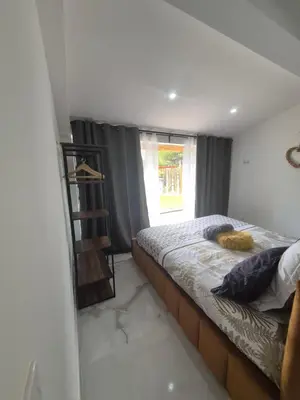 a bedroom with a bed and a window at Ô nuits de saint cannat in Saint-Cannat