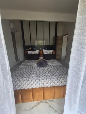 a bedroom with a large bed with curtains around it at Ô nuits de saint cannat in Saint-Cannat