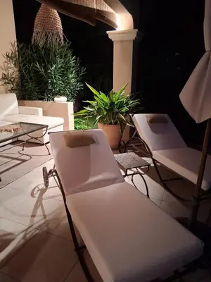 a group of chairs sitting on a patio with plants at AAD maison de vacances avec piscine in LʼIsle-sur-la-Sorgue