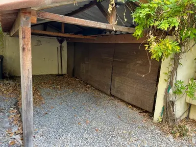 a wooden pergola on top of a garage at La casa du Roy René in Aix-en-Provence