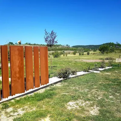 a row of orange lockers in a field at Le colibri du Luberon in Apt