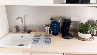 a kitchen counter top with a sink and a sink at Studio MAREVA in Cavaillon