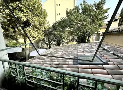 a view of a walkway from a balcony at T2 à 5mn à pieds du Cours Mirabeau in Aix-en-Provence