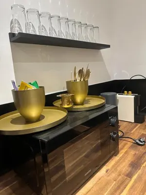 a bathroom with a tub and a sink and a mirror at Bel appartement 1er étage au centre ville de Carpentras in Carpentras