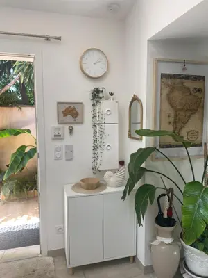 a kitchen with a white refrigerator and a plant at Tiny House - Les Baïsses - Jardin Tropical in Lançon-Provence
